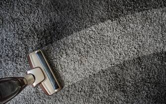 Close-up Of man  using A Vacuum Cleaner professional vacuum cleaner