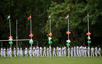 School students line up for a programme during a ceremony to celebrate India's 75th Independence Day at the railway sports complex ground in Hyderabad on August 15, 2022. (Photo by Noah SEELAM / AFP) (Photo by NOAH SEELAM/AFP via Getty Images)