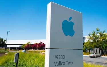 Low-angle view of blue colored sign with logo and buildings near the headquarters of Apple Computers in the Silicon Valley, Cupertino, California, August 26, 2018. (Photo by Smith Collection/Gado/Getty Images)