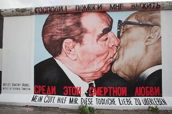 Russian artist Dmitry Vrubel famous Berlin Wall painting of Leonid Brezhnev kissing East German leader Erich Honecker. (Photo by robert wallis/Corbis via Getty Images)
