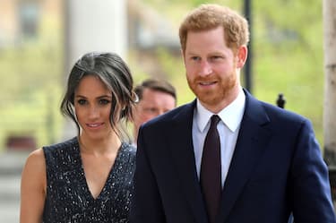 Britain's Prince Harry (R) and his US fiancee Meghan Markle arrive to attend a memorial service at St Martin-in-the-Fields in Trafalgar Square in London, on April 23, 2018, to commemorate the 25th anniversary of the murder of Stephen Lawrence. - Prince Harry will attended a memorial on Monday marking the 25th anniversary of the racist murder of black teenager Stephen Lawrence in a killing that triggered far-reaching changes to British attitudes and policing. The prince and his fiancee Meghan Markle joined Stephen's mother Doreen Lawrence, who campaigned tirelessly for justice after her son was brutally stabbed to death at a bus stop on April 22, 1993. (Photo by Victoria Jones / POOL / AFP)        (Photo credit should read VICTORIA JONES/AFP via Getty Images)