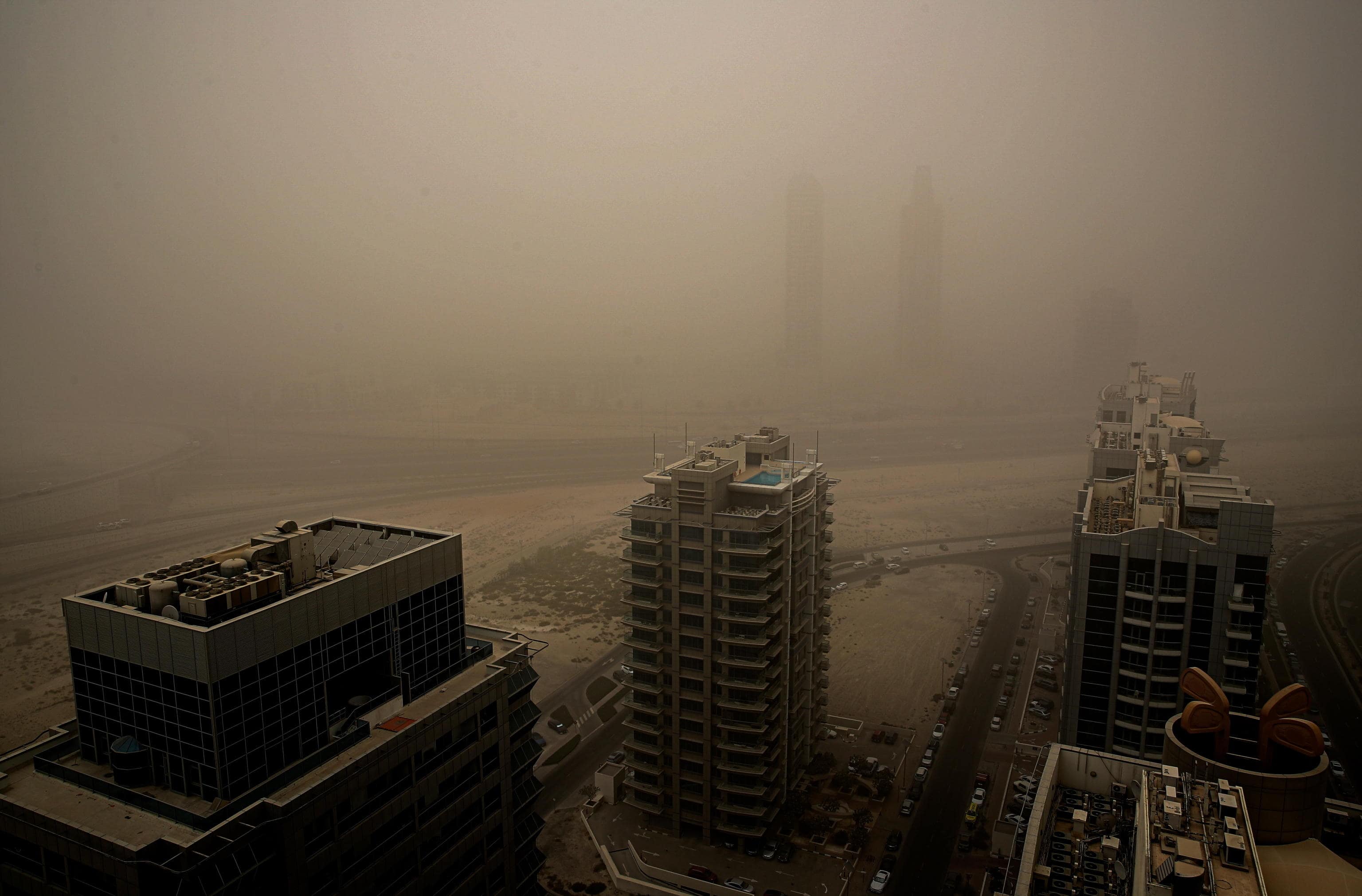epa10120658 A general view of Dubai city with heavy dust shrouding buildings during a sandstorm in Gulf emirate of Dubai, United Arab Emirates, 14 August 2022.  A red alert has been issued by the UAE authorities, warning residents of hazardous weather conditions across the country, which is affected with hazy and dusty conditions, will continue for the coming days, as the UAE National Center of Meteorology has advised and warned.  EPA/ALI HAIDER