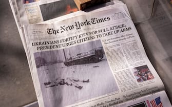 NEW YORK, NY - FEBRUARY 26: The front-page of The New York Times shows a picture of a dead Russian soldier covered in snow in Kharkiv, Ukraine February 26, 2022 on a newsstand in the Brooklyn borough of New York City.  The picture was taken by staff photographer Tyler Hicks.  (Photo by Robert Nickelsberg / Getty Images)