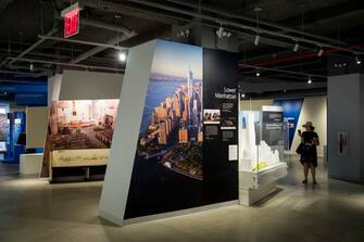 695631996 NEW YORK, NY - JUNE 13: A woman takes a photograph during the inaugural tour of the new 9/11 Tribute Museum in Lower Manhattan, June 13, 2017 in New York City. The new 9/11 Tribute Museum is officially opening today in an expanded location. The museum shares the personal stories of those directly impacted by the September 11, 2001 terrorist attacks on the World Trade Center. (Photo by Drew Angerer/Getty Images)
