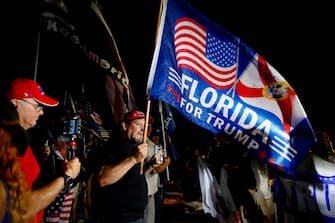 PALM BEACH, FL - AUGUST 08: Supporters of former President Donald Trump rally near the home of former President Donald Trump at Mar-A-Lago on August 8, 2022 in Palm Beach, Florida. The FBI raided the home to retrieve classified White House documents. (Photo by Eva Marie Uzcategui/Getty Images)