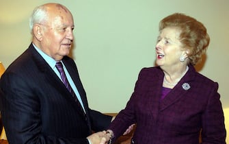 Former Soviet President Mikhail Gorbachev shakes hands with Lady Tharcher during a meeting in Lord Powell's office in London, Wednesday October 19, 2005. PRESS ASSOCIATION Photo.  Photo credit should read: Michael Stephens / PA (Photo by Michael Stephens - PA Images / PA Images via Getty Images)