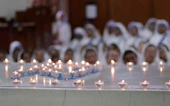 epa10160664 Nuns participate in a mass prayer near Mother's tomb at Mother House on Mother Teresa's 25th death anniversary in Kolkata, India 05 September 2022. Mother Teresa who died on 05 September 1997, at the age of 87, was popularly known as the 'Saint of the Gutter 'for her extraordinary love and dedication to poor, homeless and diseased people.  She won the Nobel Peace Prize in 1979. Mother Teresa was canonized as a saint by Pope Francis in 2016. EPA / PIYAL ADHIKARY