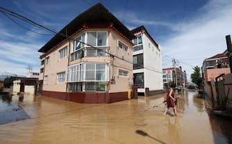 epa10163210 A village is flooded in the aftermath of the super strong Typhoon Hinnamnor that receded on the morning, in Pohang, South Korea, 06 September 2022.  EPA/YONHAP SOUTH KOREA OUT