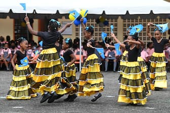 CASTRIES, ST LUCIA - APRIL 28: Schoolchildren perform a dance at the Camille Henry Memorial school on April 28, 2022 in Castries, St Lucia. The Earl and Countess of Wessex are touring the region for one week, with visits to Antigua and Barbuda, St Lucia, and St Vincent and the Grenadines. The tour forms part of Queen Elizabeth II's Platinum Jubilee celebrations. (Photo by Stuart C. Wilson/Getty Images)