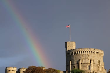 WINDSOR, ENGLAND - SEPTEMBER 08: The Union flag is lowered on Windsor Castle as a rainbow covers the sky on September 08, 2022 in Windsor, England. Elizabeth Alexandra Mary Windsor was born in Bruton Street, Mayfair, London on 21 April 1926. She married Prince Philip in 1947 and acceded the throne of the United Kingdom and Commonwealth on 6 February 1952 after the death of her Father, King George VI. Queen Elizabeth II died at Balmoral Castle in Scotland on September 8, 2022, and is survived by her four children, Charles, Prince of Wales, Anne, Princess Royal, Andrew, Duke Of York and Edward, Duke of Wessex.  (Photo by Chris Jackson/Getty Images)