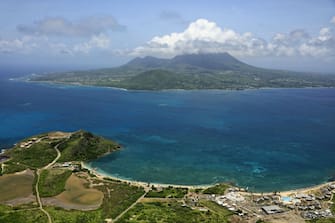 The Caribbean, St. Kitts and Nevis: aerial view of The Narrows ('The Straits') channel between the islands of Nevis (foreground) and St. Christopher.  (Photo by: Hedelin F / Andia / Universal Images Group via Getty Images)