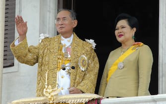 BANGKOK, THAILAND - JUNE 9: Thailand's King Bhumibol Adulyadej and Queen Sirikit wave to the thousands of people waiting outside the Royal Plaza to pay tribute to King Bhumibol Adulyadej on June 9, 2006 in Bangkok, Thailand. Thailand begins a five-day celebration to mark the 60th anniversary of the Thai Kings accession to the throne. (Photo by Pool-Getty images) 