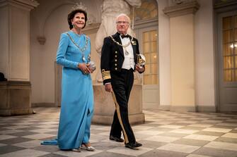 epa10179201 King Carl Gustav XVI (R) and Queen Silvia (L) of Sweden arrive to a gala banquet at Christiansborg Palace in Copenhagen, Denmark, 11 September 2022. The banquet was held to mark the 50th anniversary of Danish Queen Margrethe II's accession to the throne.  EPA/Mads Claus Rasmussen  DENMARK OUT