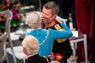 epa10179210 Danish Queen Margrethe (L) gives her son Crown Prince Frederik (R) a hug after his speech at a gala banquet at Christiansborg Palace in Copenhagen, Denmark, 11 September 2022. The banquet was held to mark the 50th anniversary of Danish Queen Margrethe II's accession to the throne.  EPA/Mads Claus Rasmussen  DENMARK OUT