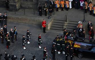 King Charles III, the Princess Royal, the Duke of York and the Earl of Wessex stand behind Queen Elizabeth II's coffin as the hearse arrives at St Giles' Cathedral, from Palace of Holyroodhouse, Edinburgh. Picture date: Monday September 12, 2022.