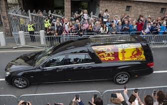 The hearse carrying the coffin of Queen Elizabeth II travels along the Royal Mile in Edinburgh to the Palace of Holyroodhouse as it completes it journey from Balmoral. Picture date: Sunday September 11, 2022.