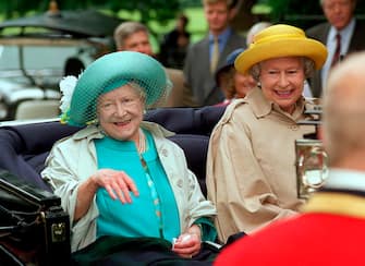 SANDRINGHAM, UNITED KINGDOM - AUGUST 02:  The Queen Mother With Her Daughter, The Queen, Leaving Travelling In An Open Carriage To Sandringham Church In Norfolk Just Before Her 98th Birthday.  (Photo by Tim Graham Photo Library via Getty Images)
