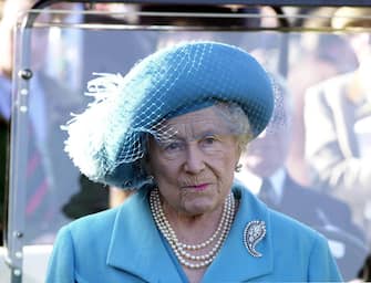 The Queen Mother in thoughtful mood as she views the horses in the parade ring, during the second day of the Cheltenham Festival.   (Photo by Barry Batchelor - PA Images/PA Images via Getty Images)