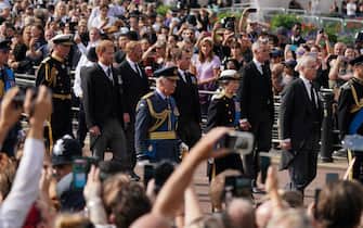 (left to right) The Duke of Wales, The Duke of Sussex, King Charles III, the Princess Royal, the Duke of York and the Earl of Wessex walk behind the coffin of Queen Elizabeth II, draped in the Royal Standard with , the Imperial State Crown placed on t, op,as its carried on a horse-drawn gun carriage of the King's Troop Royal Horse Artillery, during the ceremonial procession from Buckingham Palace to Westminster Hall, London, where it will lie in state ahead of her funeral on Monday. Picture date: Wednesday September 14, 2022.