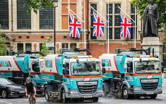 epa10183072 Street sweeper trucks at work ahead of the procession to carry the body of Britain's late Queen Elizabeth II from Buckingham Palace to Westminster Hall, in London, Britain, 14 September 2022. The late queen will lie in state for four days inside Westminster Hall until the morning of her funeral, to be held on 19 September.  EPA / GUY BELL