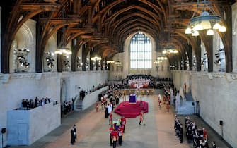 The Bearer Party from Queen's Company, 1st Battalion Grenadier Guards, carries the coffin of Queen Elizabeth II into Westminster Hall, London, where it will lie in state ahead of her funeral on Monday. Picture date: Wednesday September 14, 2022.