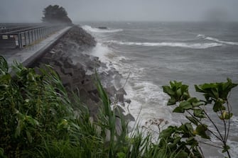 High waves from weather patterns brought about by Typhoon Nanmadol hit the coastline in Minamata, Kumamoto prefecture on September 18, 2022. - Thousands of people were in shelters in southwestern Japan on September 18 as powerful Typhoon Nanmadol churned towards the region, prompting authorities to urge nearly three million residents to evacuate. (Photo by Yuichi YAMAZAKI / AFP) (Photo by YUICHI YAMAZAKI/AFP via Getty Images)