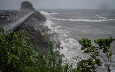 High waves from weather patterns brought about by Typhoon Nanmadol hit the coastline in Minamata, Kumamoto prefecture on September 18, 2022. - Thousands of people were in shelters in southwestern Japan on September 18 as powerful Typhoon Nanmadol churned towards the region, prompting authorities to urge nearly three million residents to evacuate. (Photo by Yuichi YAMAZAKI / AFP) (Photo by YUICHI YAMAZAKI/AFP via Getty Images)