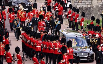 TOPSHOT - Britain's King Charles III, Britain's Anne, Princess Royal, Prince Andrew, Duke of York, Prince Edward, Earl of Wessex, Britain's William, Prince of Wales, and Britain's Prince Harry, Duke of Sussex, follow the hearse carrying the coffin on the day of the state funeral and burial of Britain's Queen Elizabeth, at Windsor Castle in Windsor, Britain, September 19, 2022. (Photo by HENRY NICHOLLS / POOL / AFP) (Photo by HENRY NICHOLLS/POOL/AFP via Getty Images)