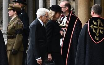 Italy's President Sergio Mattarella (L) and his daughter Laura Mattarella arrive at Westminster Abbey in London on September 19, 2022, for the State Funeral Service for Britain's Queen Elizabeth II. - Leaders from around the world will attend the state funeral of Queen Elizabeth II. The country's longest-serving monarch, who died aged 96 after 70 years on the throne, will be honoured with a state funeral on Monday morning at Westminster Abbey. (Photo by Marco BERTORELLO / AFP) (Photo by MARCO BERTORELLO/AFP via Getty Images)