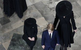 The Princess of Wales, Prince George (center), and Princess Charlotte (left), arrives for the State Funeral of Queen Elizabeth II, held at Westminster Abbey, London.  Picture date: Monday September 19, 2022.
