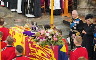King Charles III and the Queen Consort in front of the coffin of Queen Elizabeth II during her State Funeral at the Abbey in London. Picture date: Monday September 19, 2022.