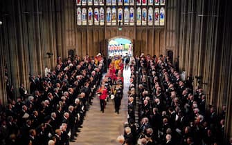 King Charles III and members of the royal family follow behind the coffin of Queen Elizabeth II as it is carried into St George's Chapel in Windsor Castle, Berkshire for her Committal Service. Picture date: Monday September 19, 2022.