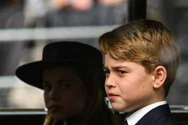 LONDON, ENGLAND - SEPTEMBER 19: Britain's Princess Charlotte of Wales (L) and Britain's Prince George of Wales travel by car from Westminster Abbey to Wellington Arch after the State Funeral of Queen Elizabeth II at Westminster Abbey on September 19, 2022 in London, England.  Elizabeth Alexandra Mary Windsor was born in Bruton Street, Mayfair, London on 21 April 1926. She married Prince Philip in 1947 and ascended the throne of the United Kingdom and Commonwealth on 6 February 1952 after the death of her Father, King George VI. Queen Elizabeth II died at Balmoral Castle in Scotland on September 8, 2022, and is succeeded by her eldest son, King Charles III. (Photo by Sebastien Bozon - WPA Pool/Getty Images)