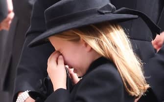 LONDON, ENGLAND - SEPTEMBER 19: Princess Charlotte of Wales cries after watching the Coffin of Queen Elizabeth II being transferred to the hearse at Wellington Arch following the State Funeral of Queen Elizabeth II on September 19, 2022 in London, England.  Elizabeth Alexandra Mary Windsor was born in Bruton Street, Mayfair, London on 21 April 1926. She married Prince Philip in 1947 and ascended the throne of the United Kingdom and Commonwealth on 6 February 1952 after the death of her Father, King George VI. Queen Elizabeth II died at Balmoral Castle in Scotland on September 8, 2022, and is succeeded by her eldest son, King Charles III. (Photo by Phil Harris - WPA Pool/Getty Images)