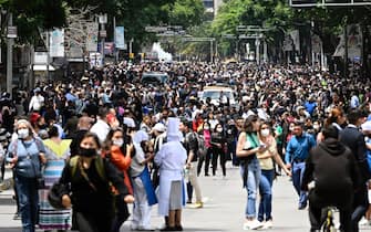 People are seen in the streets after an earthquake in Mexico City on September 19, 2022. - A 6.8-magnitude earthquake struck western Mexico on Monday, shaking buildings in Mexico City on the anniversary of two major tremors in 1985 and 2017, seismologists said. (Photo by Alfredo ESTRELLA / AFP) (Photo by ALFREDO ESTRELLA/AFP via Getty Images)