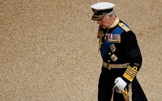 King Charles III walks through Windsor Castle ahead of a Committal Service at St George's Chapel for Queen Elizabeth II.  Picture date: Monday September 19, 2022.