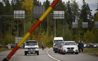 Cars coming from Russia wait in lines at the border checkpoint between Russia and Finland near Vaalimaa, on September 22, 2022. - Finland said on September 21, 2022 it was is preparing a national solution to "limit or completely prevent" tourism from Russia following the invasion of Ukraine. Since Russia's Covid-19 restrictions expired in July, there has been a boom in Russian travellers and a rising backlash in Europe against allowing in Russian tourists while the war continues. (Photo by Olivier MORIN / AFP)