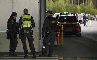 Finnish boarder guards work at the Finnish / Russian boarder crossing at Vaalimaa, Finland as traffic from Russia lines up trying to enter Finland on September 22, 2022 - Finland said on September 21, 2022 it is is preparing a national solution to 