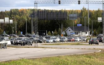 Vehicles queue to cross the border from Russia to Finland at the Nuijamaa border checkpoint in Lappeenranta, Finland, on September 22, 2022. - Finnish border authorities said on September 22, 2022 that they had seen an increase in traffic from Russia following Putin's announcement, but stressed that the influx was still at relatively low levels.  Russian President Putin's decision this week to mobilize several hundred thousand reservists has spurred a fresh exodus over the country's borders.  - Finland OUT (Photo by Lauri Heino / Lehtikuva / AFP) / Finland OUT (Photo by LAURI HEINO / Lehtikuva / AFP via Getty Images)