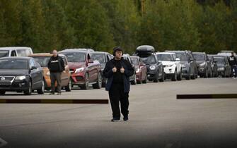 Cars coming from Russia wait in long lines at the border checkpoint between Russia and Finland near Vaalimaa, on September 22, 2022. - Finland said on September 21, 2022 it was is preparing a national solution to "limit or completely prevent" tourism from Russia following the invasion of Ukraine. Since Russia's Covid-19 restrictions expired in July, there has been a boom in Russian travellers and a rising backlash in Europe against allowing in Russian tourists while the war continues. (Photo by Olivier MORIN / AFP) (Photo by OLIVIER MORIN/AFP via Getty Images)