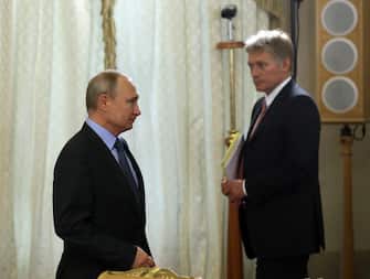 SAINT PETERSBURG, RUSSIA - JUNE 06:  Russian President Vladimir Putin (L) and his Press Secretary Dmitry Peskov (R) seen during Russian-Bulgarian meeting at Konstantin Palace on June 6 2019 in Saint Petersburg, Russia. Vladimir Putin is expected to receive foreign leaders at the SPIEF 2019 Saint Petersburg Economic Forum planned for June 7. (Photo by Mikhail Svetlov/Getty Images)