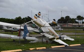 A general view of the aftermath as Small aircraft are seen flipped up side down after a reported tornado touches down at North Perry Airport as Hurricane Ian approaches

-PICTURED: General View (Aftermath of a Tornado at North Perry Airport In Florida As Hurricane Ian Approaches)
-LOCATION: Pembroke Pines USA
-DATE: 28 Sep 2022
-CREDIT: Robert Bell/INSTARimages.com