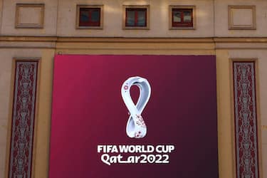 The official logo of the FIFA World Cup Qatar 2022 is unveiled on a giant screen in Madrid on September 3, 2019. (Photo by GABRIEL BOUYS / AFP) (Photo by GABRIEL BOUYS/AFP via Getty Images)