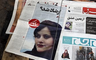epa10191412 Iranian daily newspapers reporting Mahsa Amini s death, in Tehran, Iran, 18 September 2022. Mahsa Amini, a 22 year old girl, was detained on 13 September by the police unit responsible for enforcing Iran's strict dress code for women. Amini was declared dead on 16 September, after she spent 3 days in a coma. Protests broke out in Saqez, hometown of Amini during her funeral on 17 September.  EPA/ABEDIN TAHERKENAREH