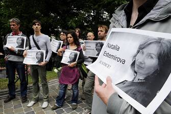 89074442 People demonstrate during a rally in memory of murdered human rights activist Natalia Estemirova, in Brussels on July 17, 2009. Estemirova, 50, was abducted outside her home in the troubled Russian province of Chechnya on July 15, 2009. Her body was found with gunshot wounds to the head and chest later the same day in the neighboring region of Ingushetia. AFP PHOTO / Dominique FAGET (Photo credit should read DOMINIQUE FAGET/AFP via Getty Images)