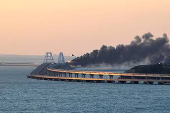 Russia.  Kerch.  OCTOBER 8, 2022. Fire on a section of a bridge linking Crimea to mainland Russia.  A truck exploded on the bridge causing fuel tanks of a freight train to catch fire.  Traffic has been temporarily suspended.  According to preliminary information, no casualties have been reported.  Yelena Yakimova / TASS / Sipa USA