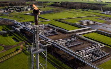 KOMMERZIJL, NETHERLANDS - NOVEMBER 22: An aerial view of a natural gas extraction plant and pipework above ground at an onshore site operated by Nederlandse Aardolie Maatschappij BV (NAM) on November 22, 2021 in Groningen, Netherlands. A recent earthquake was felt in the city of Groningen where the largest natural gas field in the European Union is located, and is scheduled to close in 2022. (Photo by Cris Toala Olivares/Getty Images)