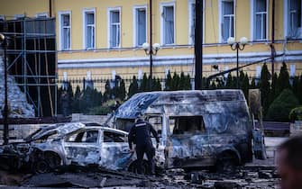 KYIV, UKRAINE - OCTOBER 10: Emergency service personnel attend to the site of a blast on October 10, 2022 in Kyiv, Ukraine. This morning's explosions, which came shortly after 8:00 local time, were the largest such attacks in the capital in months. (Photo by Ed Ram/Getty Images)                               