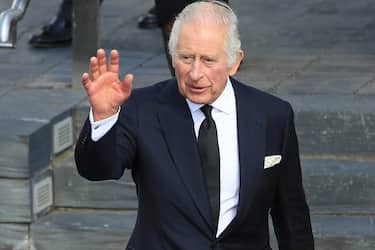 epa10188105 Britain's King Charles III waves to members of the public as he leaves the Senedd, Cardiff, Britain, 16 September 2022. The British royal couple's visit to Wales is the final stop on their tour of the four capital cities marking the King's accession to the throne after the death of Queen Elizabeth II at her Scottish estate on 08 September 2022.  EPA/JON ROWLEY