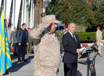 Russian President Vladimir Putin (front, R) flanked by Commander of the Russian troops in Syria Colonel General Sergei Surovikin (front, L) at the Hmeimim (also Khmeimim) Air Base, south-east of the city of Latakia in Syria, 11 December 2017. Media reports state Russian President Vladimir Putin made an unannounced visit to Syria where he met with Syrian Presidents Bashar al-Assad and ordered a withdrawal of Russian troops from Syria.  ANSA/MICHAEL KLIMENTYEV / SPUTNIK / K MANDATORY CREDIT